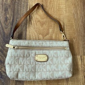 Michael Kors clutch Tan fabric with gold hardware outside pocket tan leather